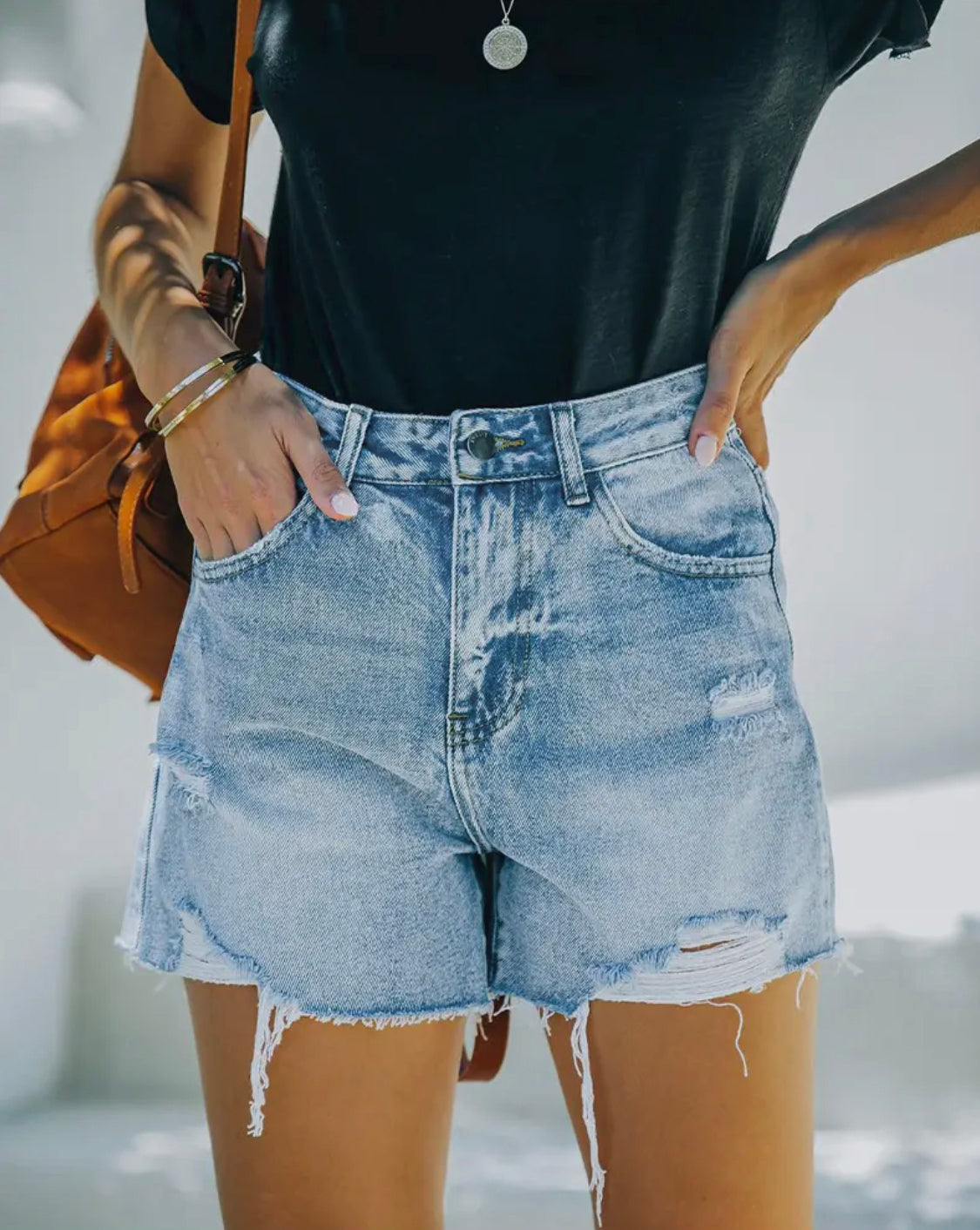 Ripped Denim Shorts with
Raw Edges