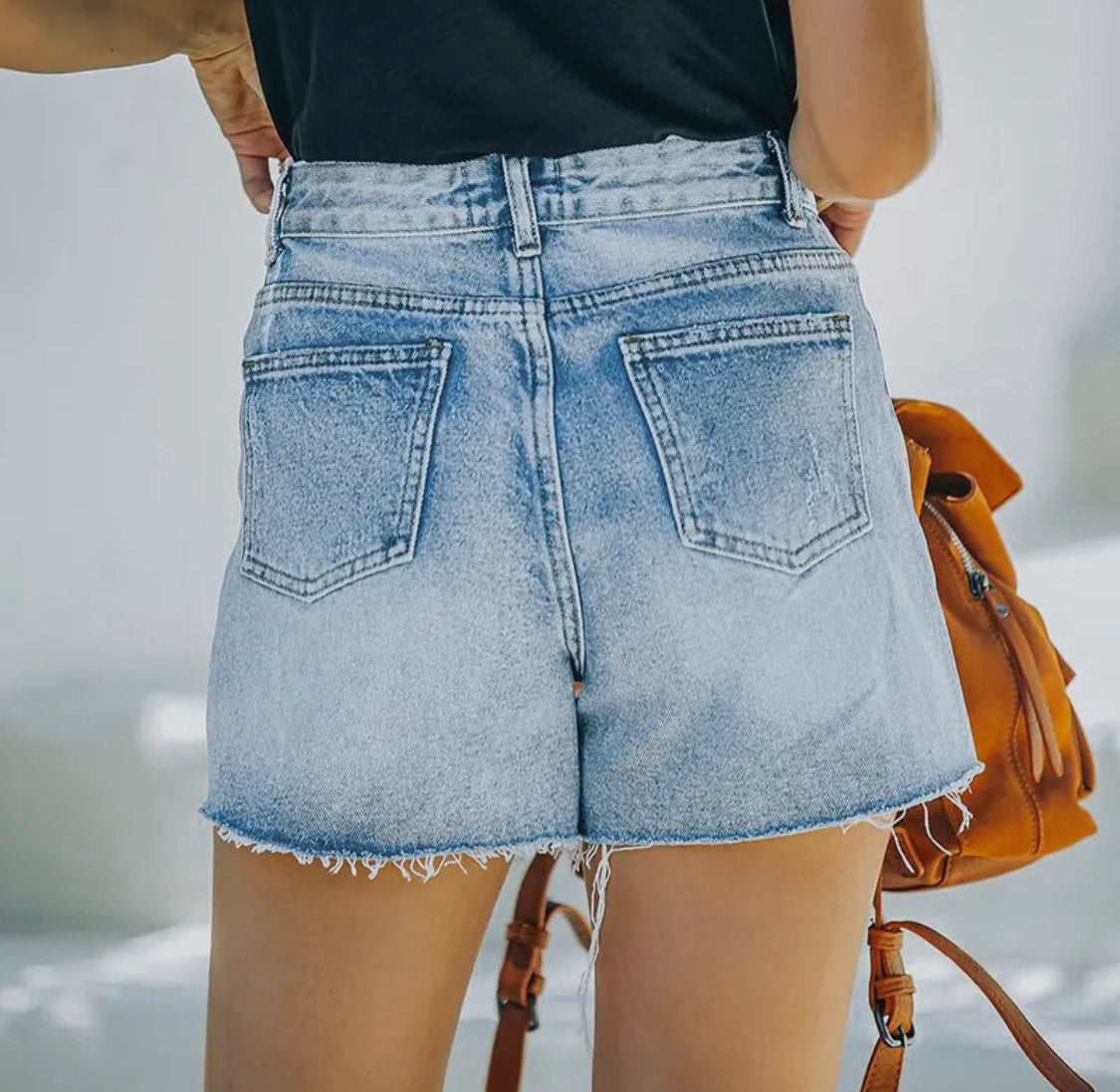 Ripped Denim Shorts with
Raw Edges